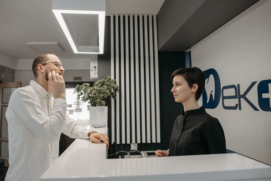 Plumber greeting a homeowner at the front door of a house, the kind of revenue moment AI for small business should protect first